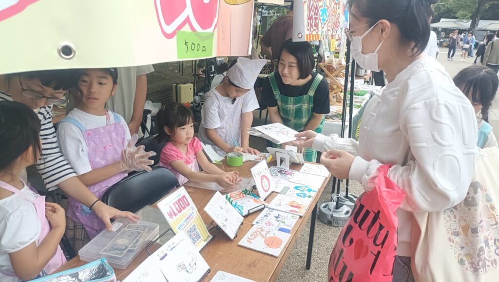 AI時代に「自分で稼ぐ」体験を。小学生が自作の絵本とクレープを実社会で販売する「経済版ボーイスカウト」を上野・不忍池で10月17日・18日に開催